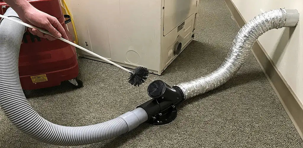 Dryer vent cleaning service removing lint from a dryer duct connection in Evansville, IN