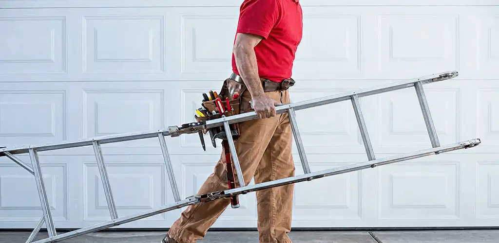 Garage door repair technician arriving with tools and ladder in Evansville, IN