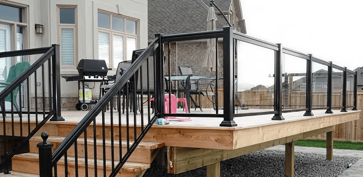 Handrail installation on a deck staircase for safety and code compliance in Evansville, IN