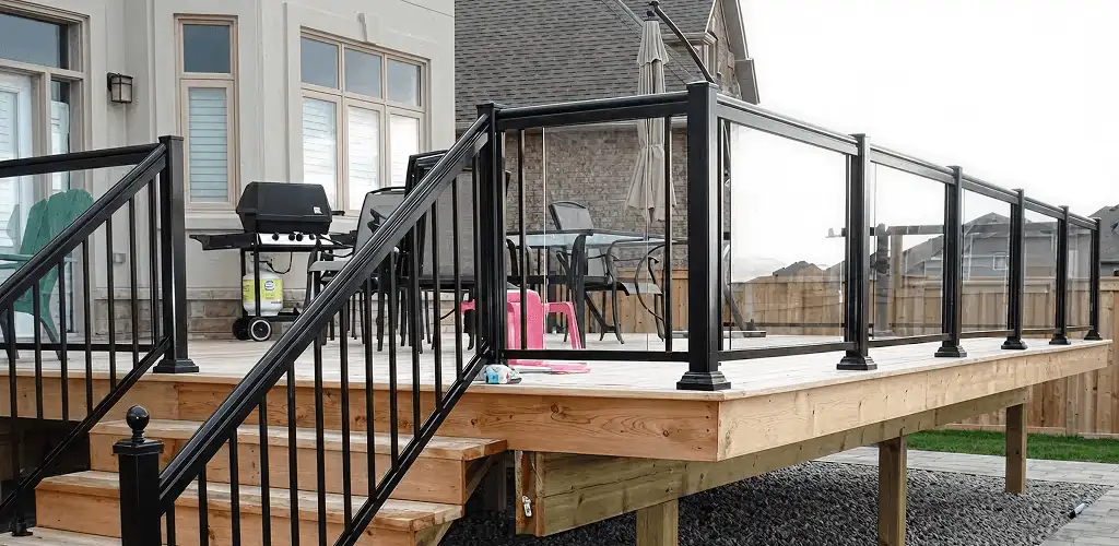 Handrail installation on a deck staircase for safety and code compliance in Evansville, IN