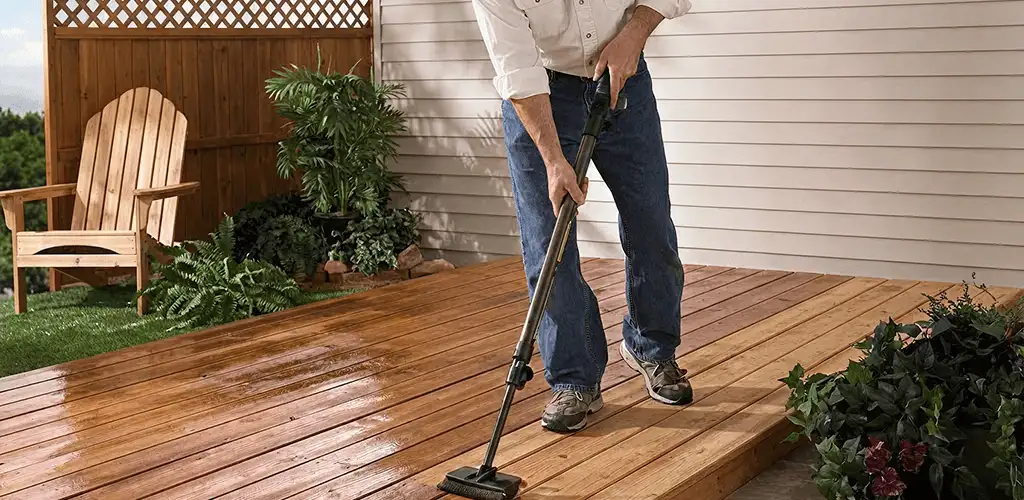 Deck staining service applying stain to a backyard wood deck in Evansville, IN